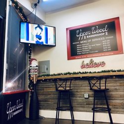 Upper Wood Barbershop - Waiting area is nice. I tagged along with my boyfriend and they are playing Mulan!
