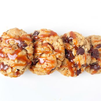 The Crumb Keeper - Mini cowboy cookies, made with oats, pecans, semi sweet chocolate chips, shredded coconut and a salted caramel drizzle - Desserts Near Me - Aurora, Colorado The Crumb Keeper - Mini cowboy cookies, made with oats, pecans, semi sweet chocolate chips, shredded coconut and a salted caramel drizzle - Desserts Near Me - Aurora, Colorado