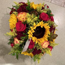 Over photo of sunflower and roses bouquet. Over photo of sunflower and roses bouquet.