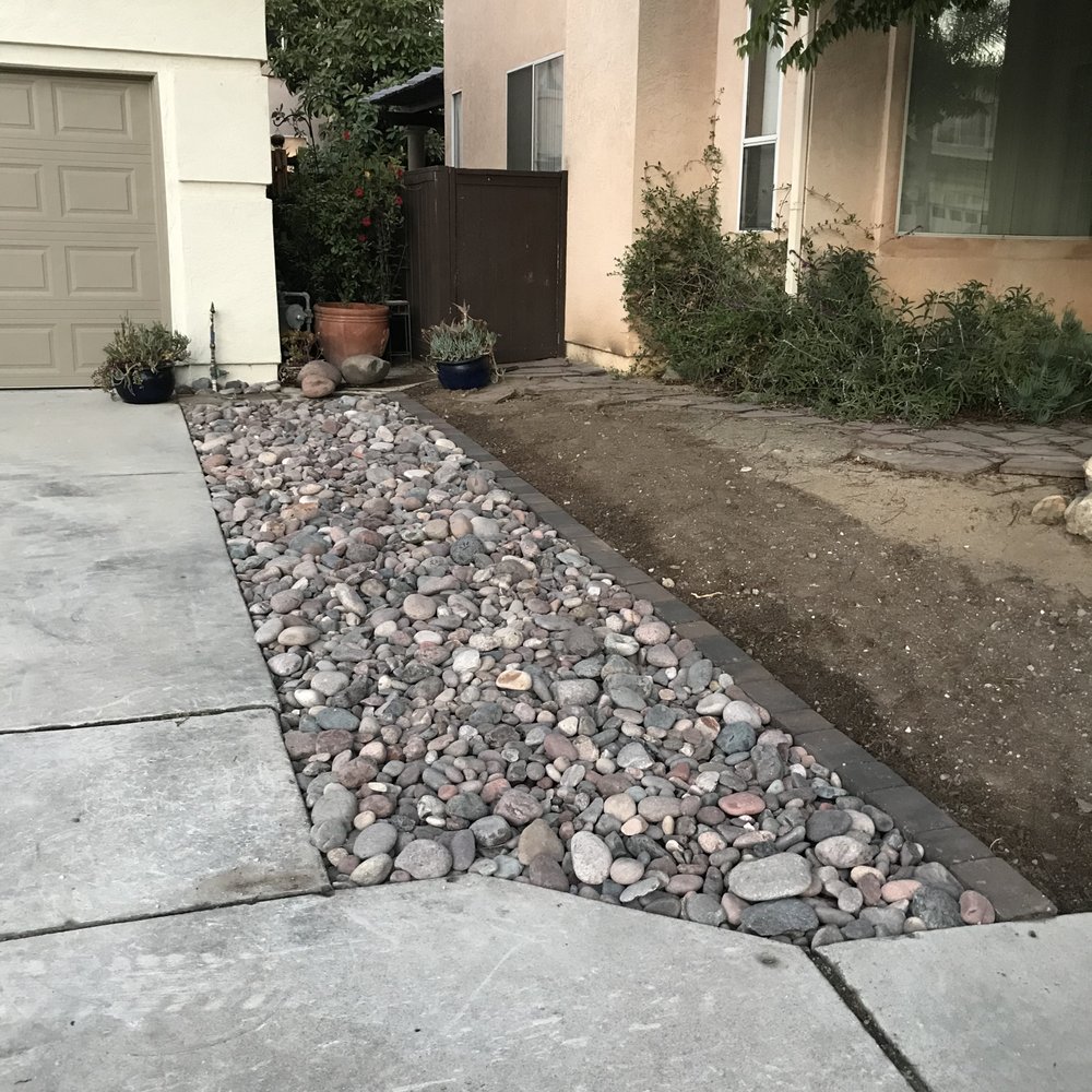 Best Choice Home Remodeling - Grass along driveway replaced with river rock. - Windows Installation Near Me - Poway, California