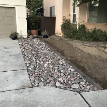 Best Choice Home Remodeling - Grass along driveway replaced with river rock. - Windows Installation Near Me - Poway, California Best Choice Home Remodeling - Grass along driveway replaced with river rock. - Windows Installation Near Me - Poway, California