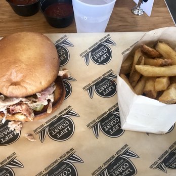 Left Coast Brewing - Chicken sandwich that had a bone in it...still tasty though! $12 with fries, not my cup of tea at a bbq place but good for chicken lovers - Barbeque Near Me - Irvine, California