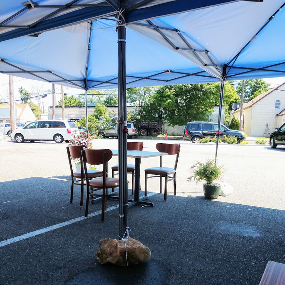 IHOP - tables under umbrella tent - Burgers Near Me - Hicksville, New York