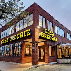 Casa Grecque Sherbrooke St - This is an exterior view of Casa Grecque on Sherbrooke between the Olympic complex and the 25, with a parking lot at the right