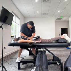 TRC+ - Dr Jesse doing manual therapy on a patient