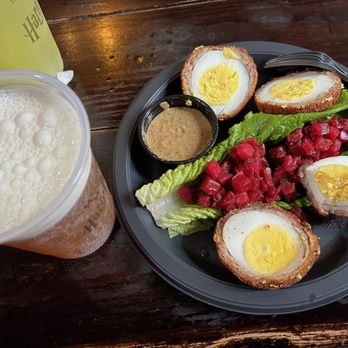 Leaky Cauldron™ - Scotch eggs with apple beet salad, mustard sauce, and a butter beer - British Near Me - Orlando, Florida