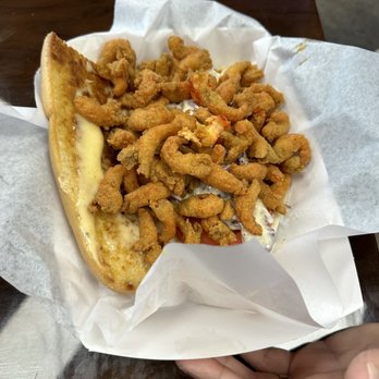 Mudbug Mobile Madness - a hand holding a basket of fried shrimp - Food Trucks Near Me Mudbug Mobile Madness - a hand holding a basket of fried shrimp - Food Trucks Near Me