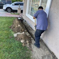 Pacific Coast Water Systems - Digging trench for copper pipes from main line to water softener