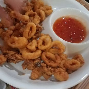 Cutlass Grille - Calamari .. and this dipping sauce has a little more kick than the shrimp one. Delicious. - Caribbean Near Me - Chesapeake, Virginia