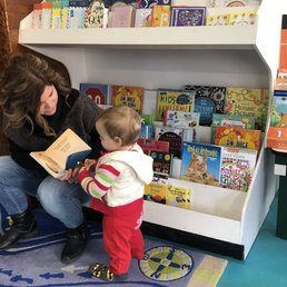 I left for a minute and walked back in to find Debi, the store owner, reading to my little girl. I left for a minute and walked back in to find Debi, the store owner, reading to my little girl.