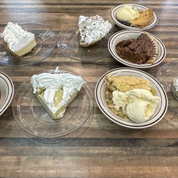 Front row from left to right: strawberry rubarb, key lime, Dutch apple, lemon icebox Back row: lemon icebox, bayou goo, blueberry, pecan