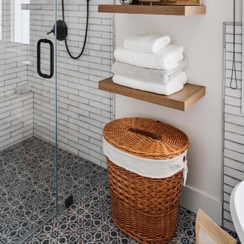 Sun Country Customs - a bathroom with a shower and a basket - General Contractors Near Me Sun Country Customs - a bathroom with a shower and a basket - General Contractors Near Me