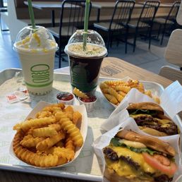 Double ShackBurgers with regular Fries and shakes chocolate and mango