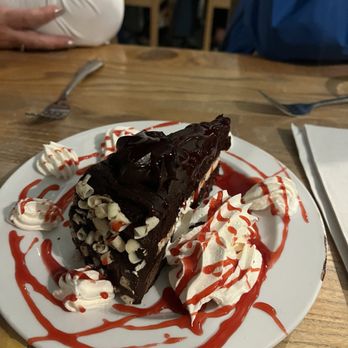 The Point - Delicious chocolate cake with a raspberry drizzle! - American Near Me - Osprey, Florida The Point - Delicious chocolate cake with a raspberry drizzle! - American Near Me - Osprey, Florida