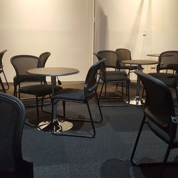 Des Moines Community Playhouse - Table seating area for the pre-performance entertainment. - Performing Arts Near Me - Des Moines, Iowa
