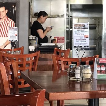 Aurelio's Pizza - Waitress sitting on counter with her phone during lunch time while we wait 30 minutes for our pizza. Now we know why the place was empty. - Pizza Near Me - Las Vegas, Nevada Aurelio's Pizza - Waitress sitting on counter with her phone during lunch time while we wait 30 minutes for our pizza. Now we know why the place was empty. - Pizza Near Me - Las Vegas, Nevada