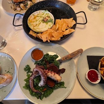 Fish N Beer - Chips & Guac on top, grilled bread on the left, Spanish Octopus in the middle and a side of fries on the right. - Seafood Near Me - Denver, Colorado