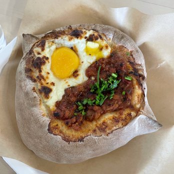 Skalka - Khachapuri with chicken stew on half and egg/cheese on half. Very good! - Breakfast & Brunch Near Me - Seattle, Washington Skalka - Khachapuri with chicken stew on half and egg/cheese on half. Very good! - Breakfast & Brunch Near Me - Seattle, Washington