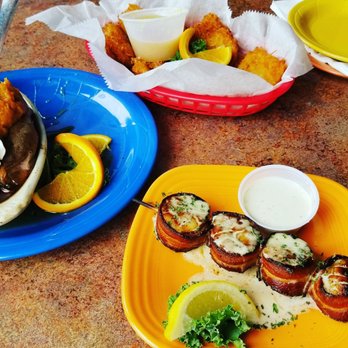 Squid Lips - Red basket - Onion Chips Blue plate - Twice baked Sweet Potato Yellow Plate - Cajun Bacon Wrapped Scallops - Seafood Near Me - Sebastian, Florida Squid Lips - Red basket - Onion Chips Blue plate - Twice baked Sweet Potato Yellow Plate - Cajun Bacon Wrapped Scallops - Seafood Near Me - Sebastian, Florida