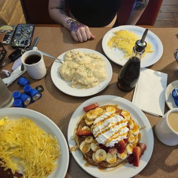 Erica's Cafe - Strawberry banana pancakes and some biscuits & gravy, hash browns and coffee. - Breakfast & Brunch Near Me - Citrus Heights, California