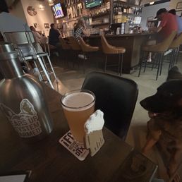 It's growler and cookies night at the LP. Axel likes it when I dip his cookie in my beer! Typical German Shepherd. lol.