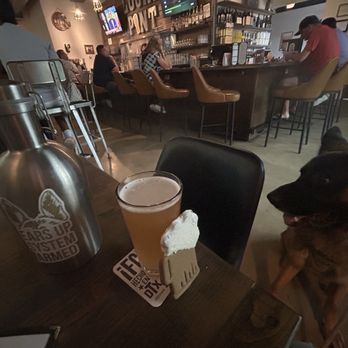 Local Pint - It's growler and cookies night at the LP. Axel likes it when I dip his cookie in my beer! Typical German Shepherd. lol. - Beer Bar Near Me - Flower Mound, Texas