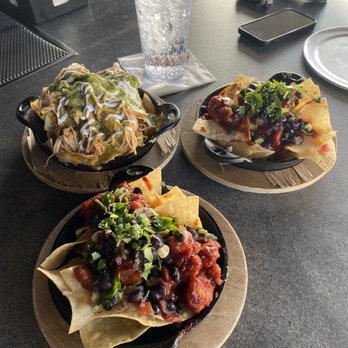Nacho Daddy - Barbecue chicken Nachos and enchilada Nachos on the top left. - Mexican Near Me - Henderson, Nevada