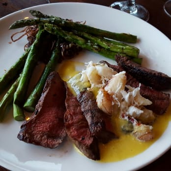 Palisade - My wagyu flat iron steak with lump crab meat hollandaise and asparagus with shoe string purple potato fries - Seafood Near Me - Seattle, Washington Palisade - My wagyu flat iron steak with lump crab meat hollandaise and asparagus with shoe string purple potato fries - Seafood Near Me - Seattle, Washington