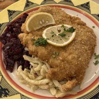 Lugano Swiss Bistro - Pork Schnitzel with spatzel and red cabbage. - Fondue Near Me - Carmel, California Lugano Swiss Bistro - Pork Schnitzel with spatzel and red cabbage. - Fondue Near Me - Carmel, California