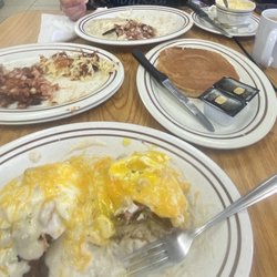 1st Street Diner - Cowboy Benedict w/ Hash Brown. Country Benedict w/ cheesy Grits. Corn Beef Hash(side) and Pancake.