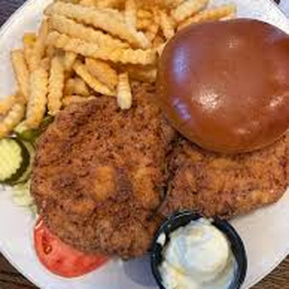 Breaded Pork Tenderloin Sandwich and Crinkle Cut Fries. Breaded Pork Tenderloin Sandwich and Crinkle Cut Fries.
