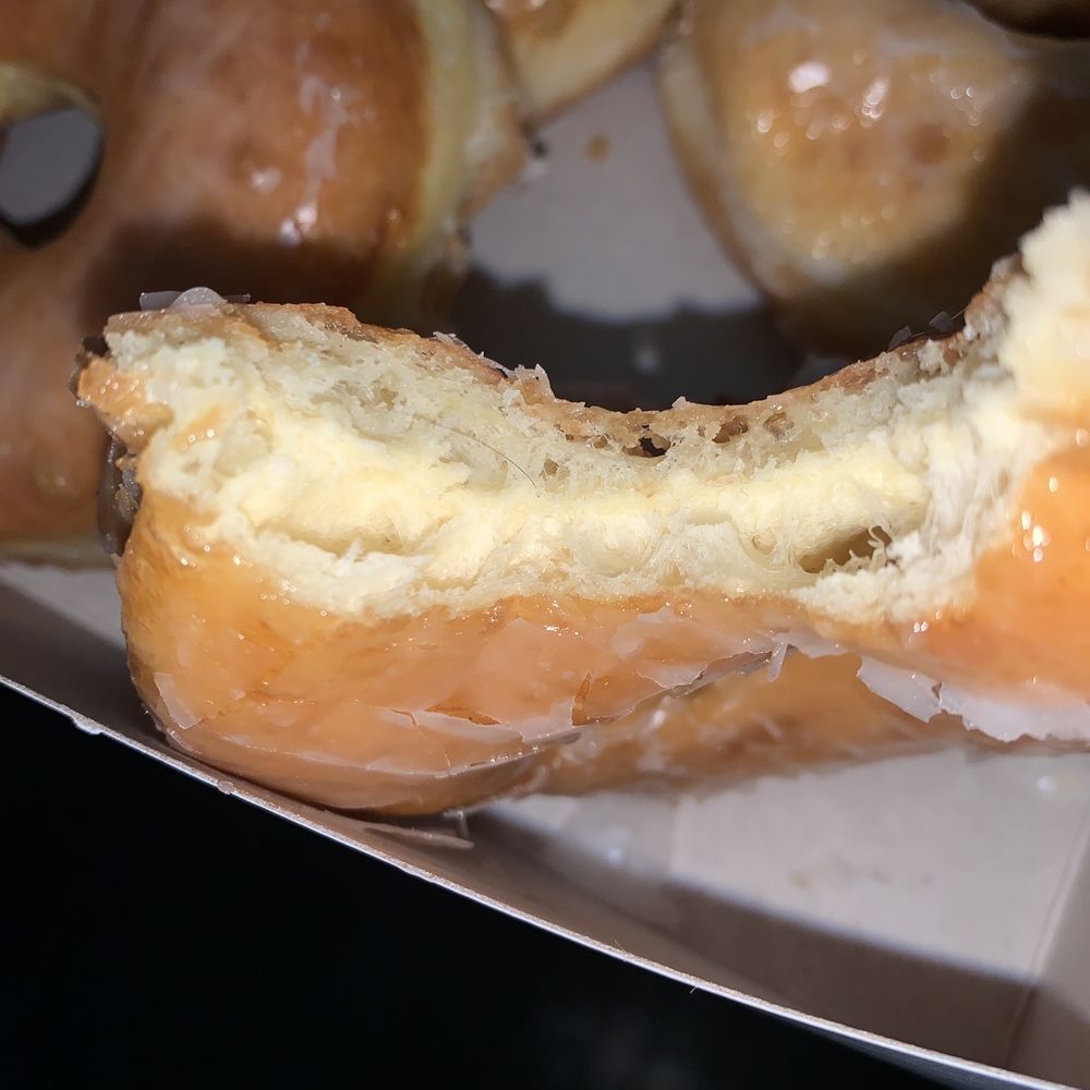 a half eaten doughnut with a bite taken out of it a half eaten doughnut with a bite taken out of it