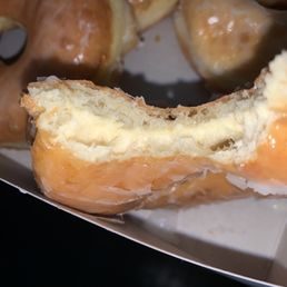 a half eaten doughnut with a bite taken out of it a half eaten doughnut with a bite taken out of it