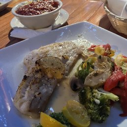 Baked haddock, and side of pasta with red sauce. Baked haddock, and side of pasta with red sauce.