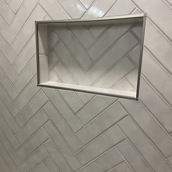 Chitown Tile - All tile within soap niche flows perfectly with surrounding tile on the tub wall in herringbone pattern! - Handyman Near Me