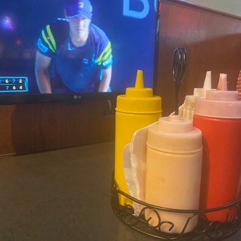Burgers & Beer - TVs at each booth and condiment basket - American Near Me - Rancho Mirage, California Burgers & Beer - TVs at each booth and condiment basket - American Near Me - Rancho Mirage, California