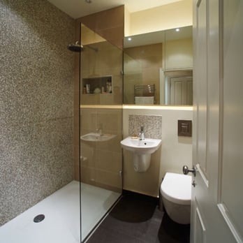 KNYC - a bathroom with a shower, sink, and toilet - General Contractors Near Me - Mapleton, New York KNYC - a bathroom with a shower, sink, and toilet - General Contractors Near Me - Mapleton, New York
