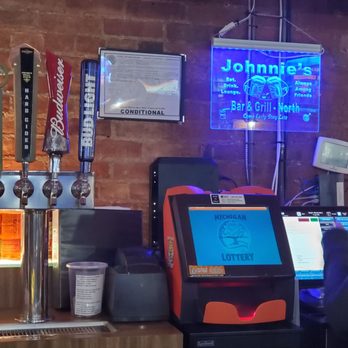 Johnnies Bar and Grill - a bartender at the bar - Bars Near Me - Clinton, Michigan Johnnies Bar and Grill - a bartender at the bar - Bars Near Me - Clinton, Michigan