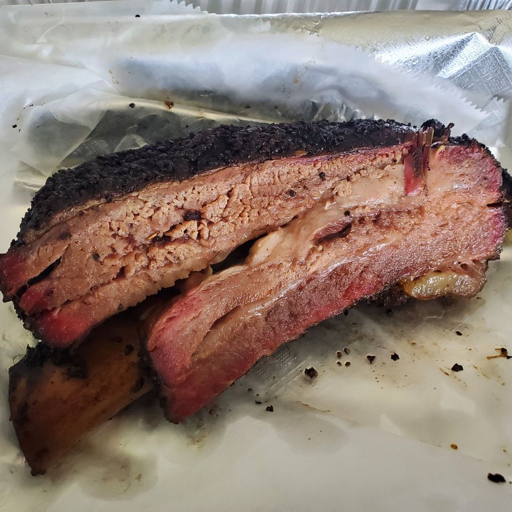 Sunset Texas Barbecue - Mammoth beef rib (nearly three pounds), available only on Saturdays. Looks small in the pic, but it's not. - Barbeque Near Me - Honolulu, Hawaii Sunset Texas Barbecue - Mammoth beef rib (nearly three pounds), available only on Saturdays. Looks small in the pic, but it's not. - Barbeque Near Me - Honolulu, Hawaii