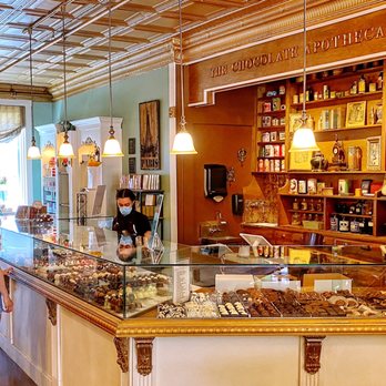 Le Chocolat Du Bouchard - a woman standing at the counter - Chocolatiers & Shops Near Me - Naperville, Illinois Le Chocolat Du Bouchard - a woman standing at the counter - Chocolatiers & Shops Near Me - Naperville, Illinois