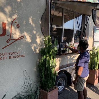 JL’s Burgers - a man ordering food from a food truck - Burgers Near Me - Charleston, South Carolina