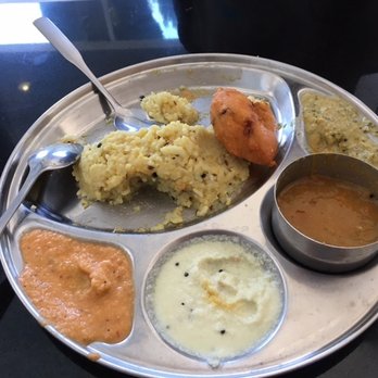 Madras Cafe - Pongal-vada at Madras Cafe: Steamed raw rice, mashed with dhal sautéed and served together with fried lentils, lentil gravy and chutneys - Indian Near Me - Sunnyvale, California Madras Cafe - Pongal-vada at Madras Cafe: Steamed raw rice, mashed with dhal sautéed and served together with fried lentils, lentil gravy and chutneys - Indian Near Me - Sunnyvale, California
