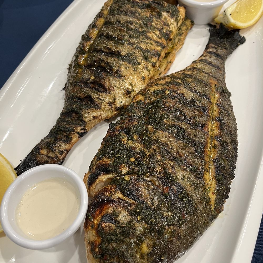 Mermaid's Seafood Restaurant - two fish on a white plate - Seafood Near Me - Ottawa, Ontario Mermaid's Seafood Restaurant - two fish on a white plate - Seafood Near Me - Ottawa, Ontario