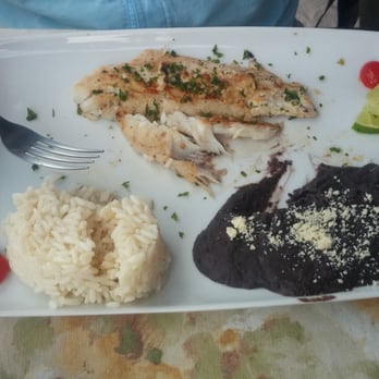 Fernando's 100% de Agave - Fish filet, lightly seasoned, with rice and beans. It was too good to not taste before I got the camera out! - Mexican Near Me - Quintana Roo, ROO