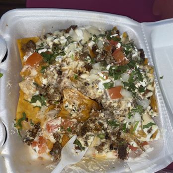 Taqueria Mirandas - Nachos campechanos but we couldn't wait to get home - Tacos Near Me - Houston, Texas