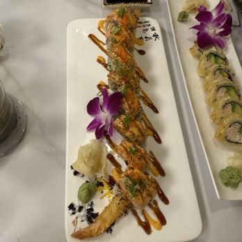 Sushi Boat - Gold dragon roll (left), fried California roll (right) - Japanese Near Me - Chesterfield, Missouri Sushi Boat - Gold dragon roll (left), fried California roll (right) - Japanese Near Me - Chesterfield, Missouri
