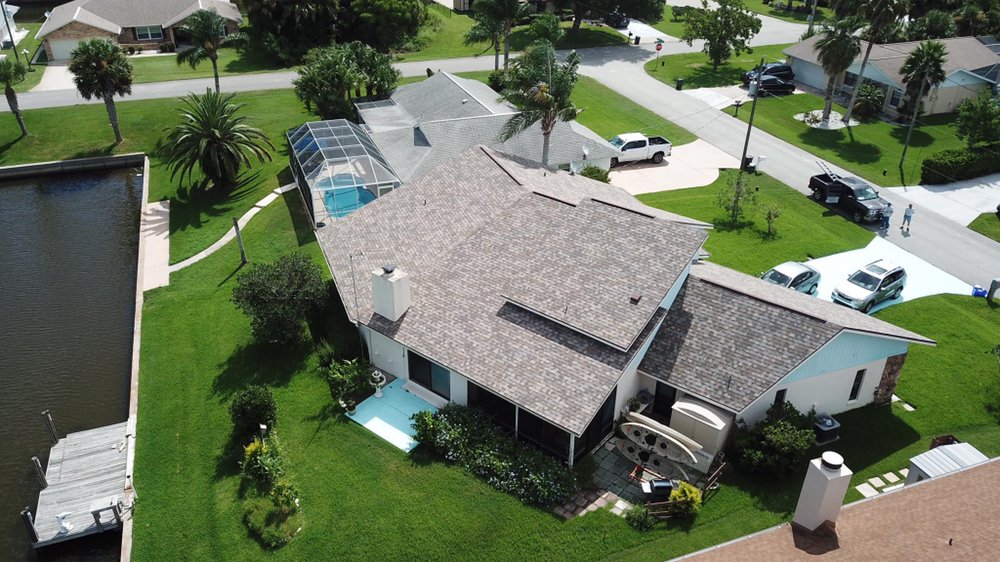 Slide of EZ Roofing of Flagler County