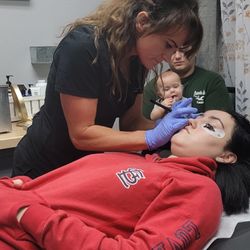 Prowax Center - Owner Amanda Wiley and Client getting a lash lift and tent and henna eyebrows services