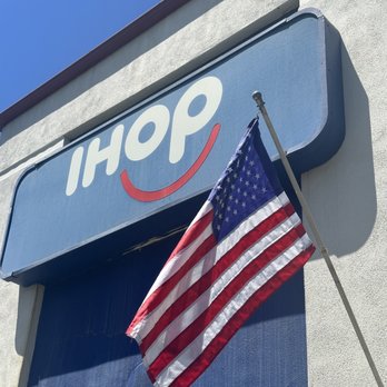 IHOP - The front IHOP sign accompanying the American flag - Breakfast & Brunch Near Me - Corona, California IHOP - The front IHOP sign accompanying the American flag - Breakfast & Brunch Near Me - Corona, California