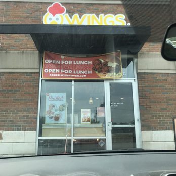 Wings Over Columbus - The store front from the outside, with two reserved pick up spaces - Chicken Wings Near Me - Upper Arlington, Ohio